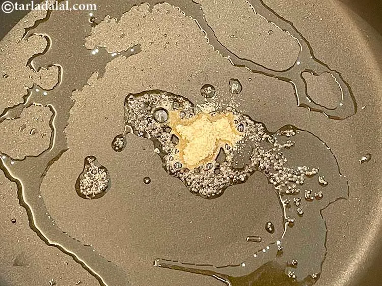 Step 8 – <meta charset="UTF-8" />When the seeds crackle, add the asafoetida.