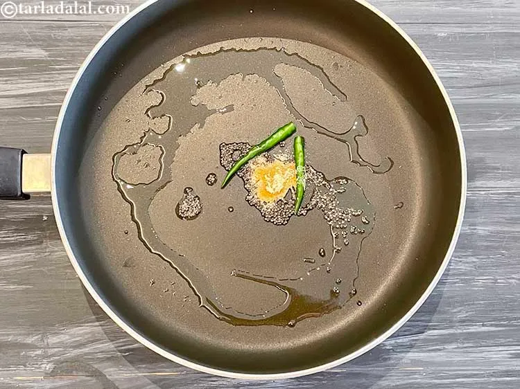 Step 9 – Add the green chillies.