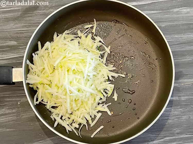 Step 11 – Add the grated raw papaya. Look above on how to make grated raw papaya.