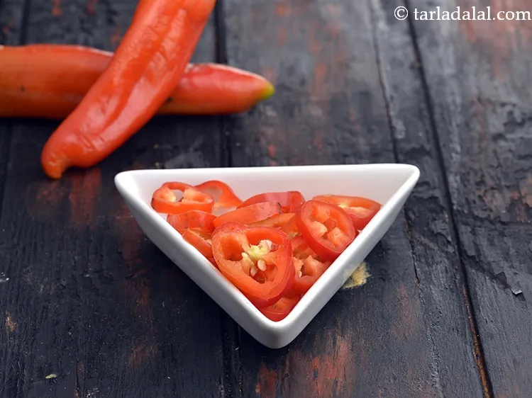 Step 47 – For a spicy cheese burst pizza, top with some fresh red chilli roundels or red …