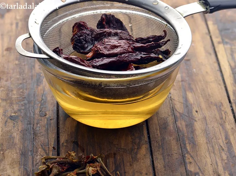 Step 4 – After 15 minutes, drain the chillies. Once they are soft, remove the stems.Traditionally, <strong>Thai</strong>&nbsp;<strong>Red Curry …