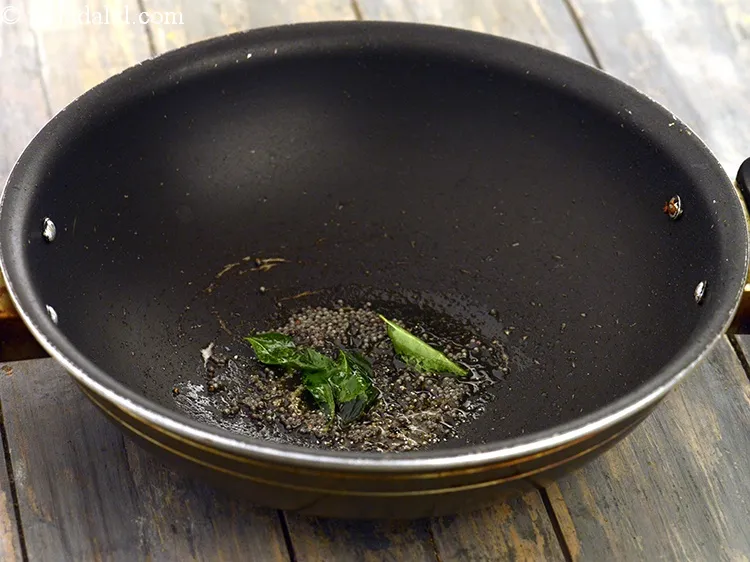 Step 10 – Add 3 to 4&nbsp;<a href="https://www.tarladalal.com/glossary-curry-leaves-kadi-patta-kadipatta-388i">curry leaves (kadi patta)</a>.