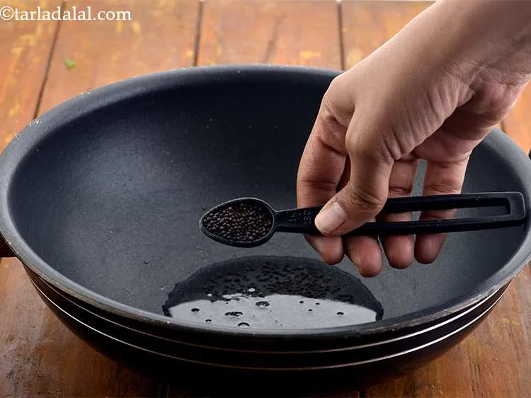 Step 9 – Add 1/2 tsp&nbsp;<a href="https://www.tarladalal.com/glossary-mustard-seeds-sarson-rai-sarson-ke-beej-525i">mustard seeds ( rai / sarson)</a>.