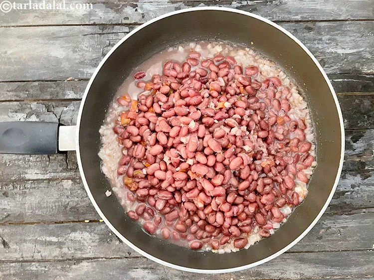 Step 53 – Add the rajma mixture.