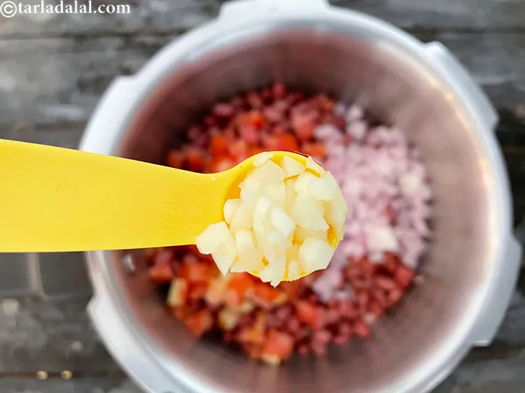 Step 12 – Add&nbsp;<meta charset="UTF-8" />1/2 tsp&nbsp;<a href="glossary-chopped-garlic-790i">chopped garlic (lehsun)</a>.