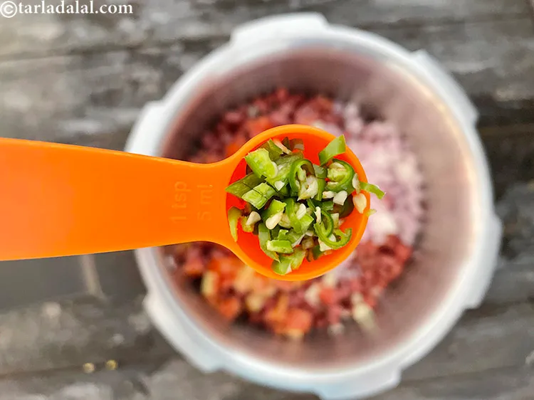 Step 68 – Add&nbsp;1/2 tsp&nbsp;finely&nbsp;<a href="https://www.tarladalal.com/glossary-chopped-green-chilli-820i">chopped green chillies</a>.