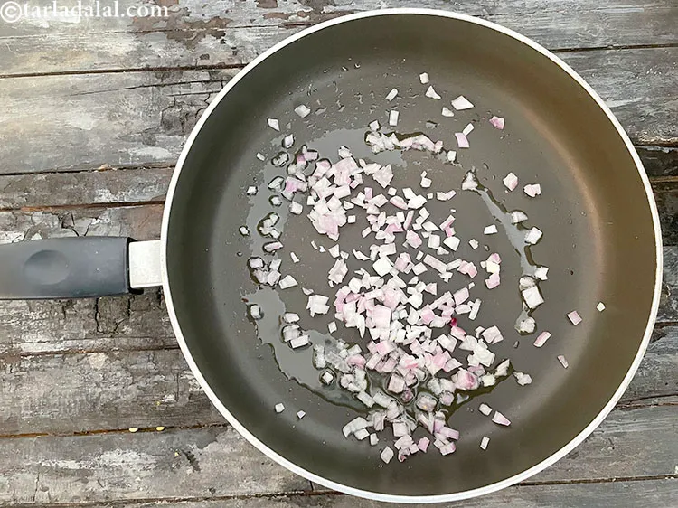 Step 75 – Add&nbsp;2 tbsp finely&nbsp;<a href="https://www.tarladalal.com/glossary-chopped-onions-722i">chopped onions</a>.
