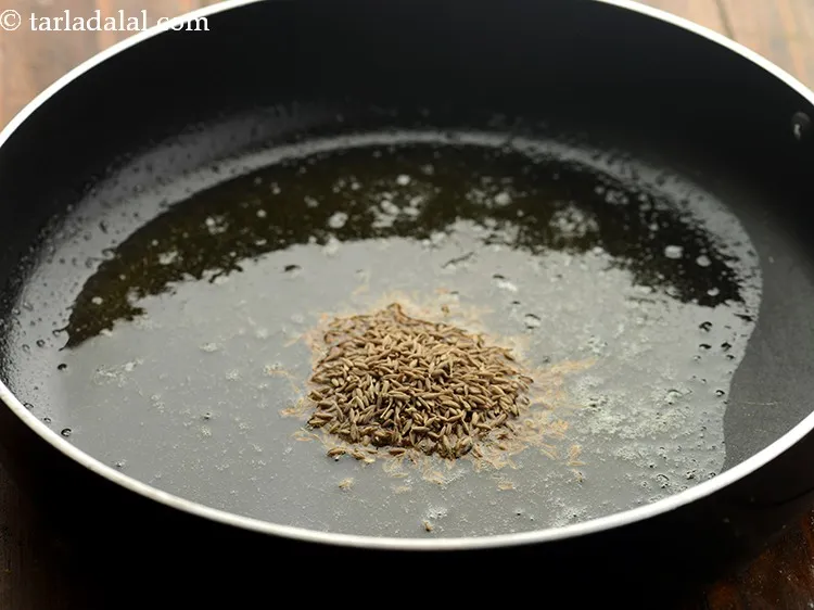 Step 29 – Do not let the ghee melt completely. When it is almost melted, add the cumin …