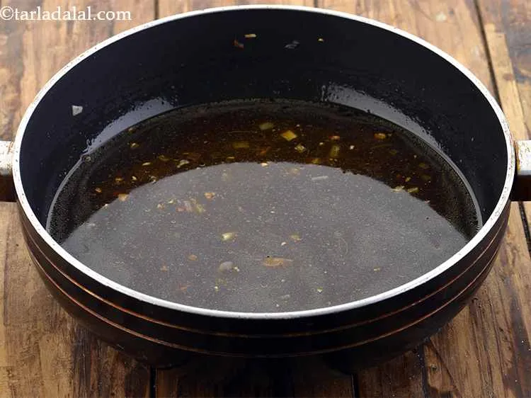 Step 23 – Now add 2 1/2 cups of water, mix well and cook on a medium flame …