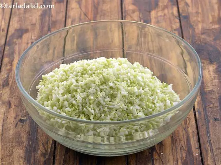 Step 2 – In a deep mixing bowl put the cabbage.