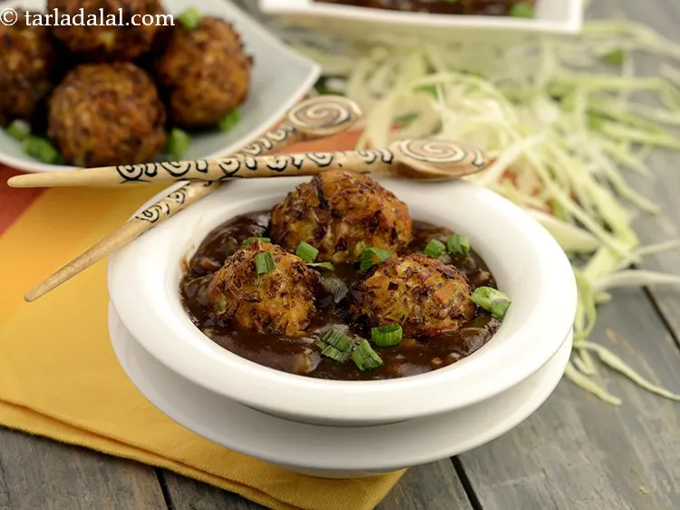 Step 29 – Serve&nbsp;<strong>Restaurant Style Vegetable Manchurian Gravy</strong>&nbsp;hot with&nbsp;<a href="https://www.tarladalal.com/Burnt-Garlic-Fried-Rice-40049r">burnt garlic fried rice.</a>