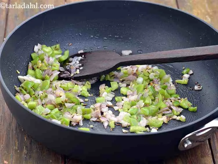 Step 7 – Add the capsicum and saut? on medium flame for 2 minutes.