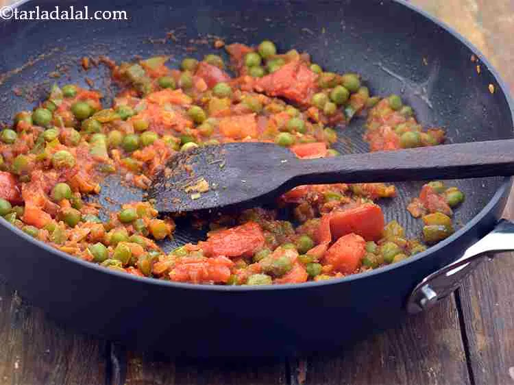 Step 11 – Add the chilli powder, coriander powder, turmeric powder and salt, mix well and cook on …