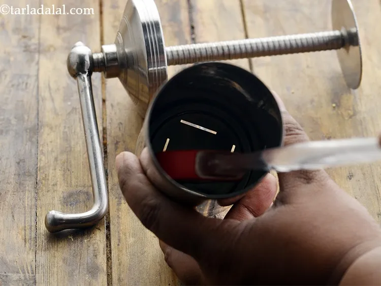 Step 10 – To prepare the <strong>Ribbon Sev</strong>, divide the <strong>ribbon sev</strong> dough into 2 equal portions. Grease …