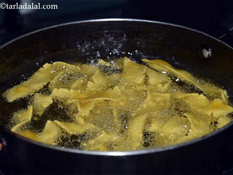 Step 14 – Deep-fry on a medium flame till it turns very light brown in colour from the …