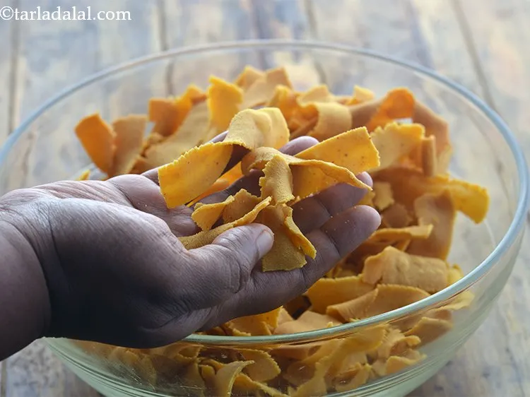 Step 18 – Break the <strong>South Indian ribbon sev</strong> it lightly once using your fingers.