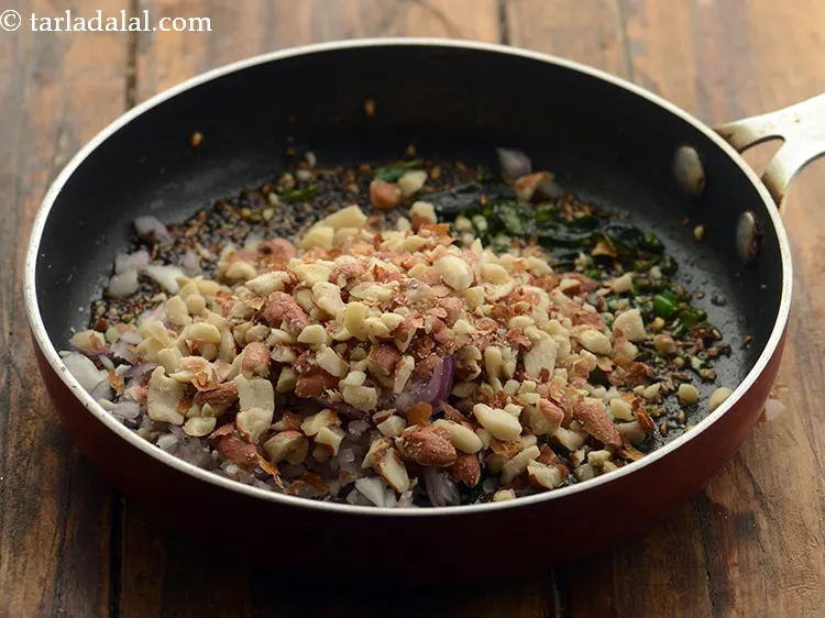 Step 21 – Add the peanuts. This gives a nice crunch and make sure they are coarsely crushed …