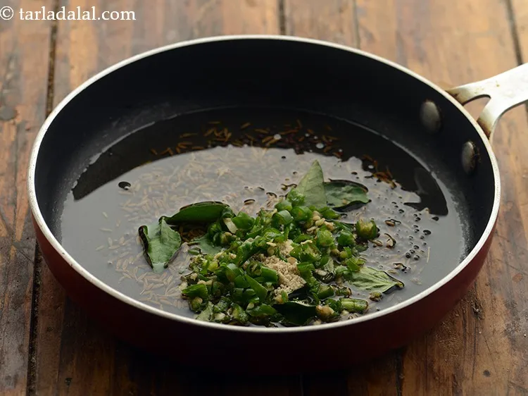 Step 18 – Add the green chillies.