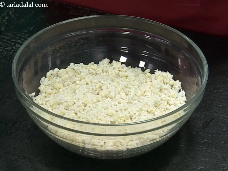 Step 2 – Add the urad dal. Wash it well under running water.