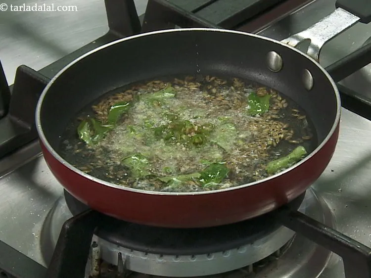 Step 18 – Add the green chillies.