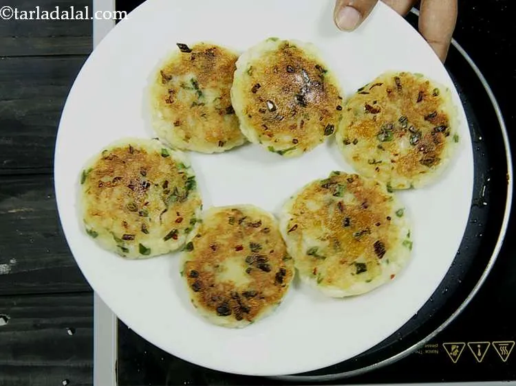 Step 13 – Remove the rice tikki on a plate and keep aside.