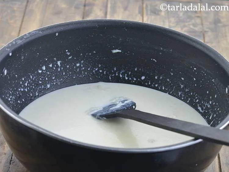 Step 12 – Simmer the milk on a slow flame for 3-5 minutes while stirring and scraping the …