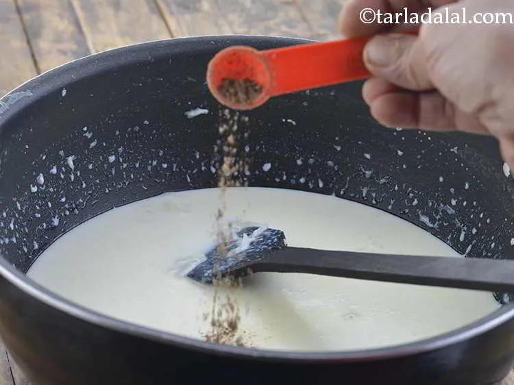 Step 13 – Add the cardamom powder and simmer on a slow flame for 2 minutes while stirring …