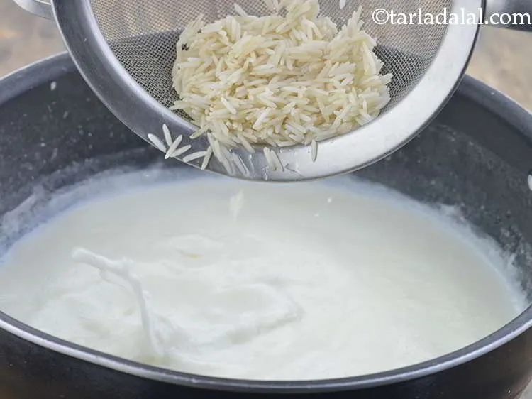 Step 5 – Add the drained rice and mix well.