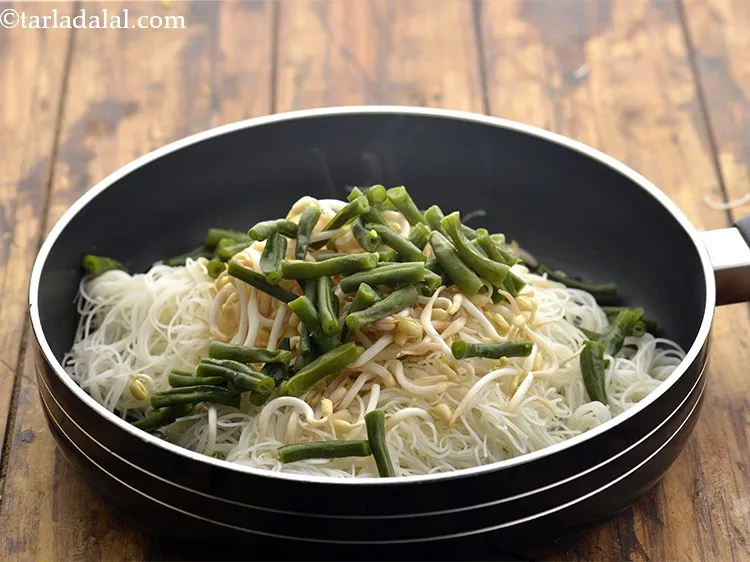 Step 14 – Next, toss in some beans.