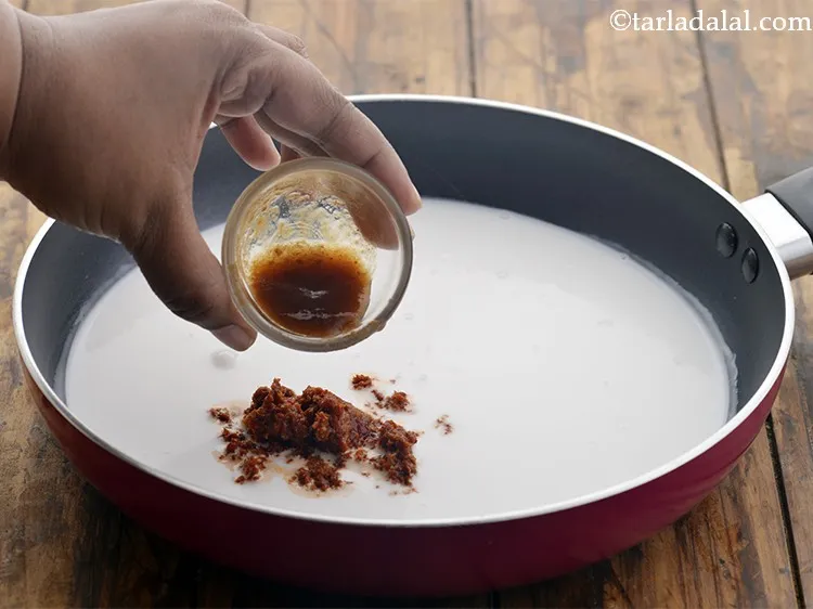 Step 21 – Add tamarind paste. It adds in the much needed tang to the curry sauce.