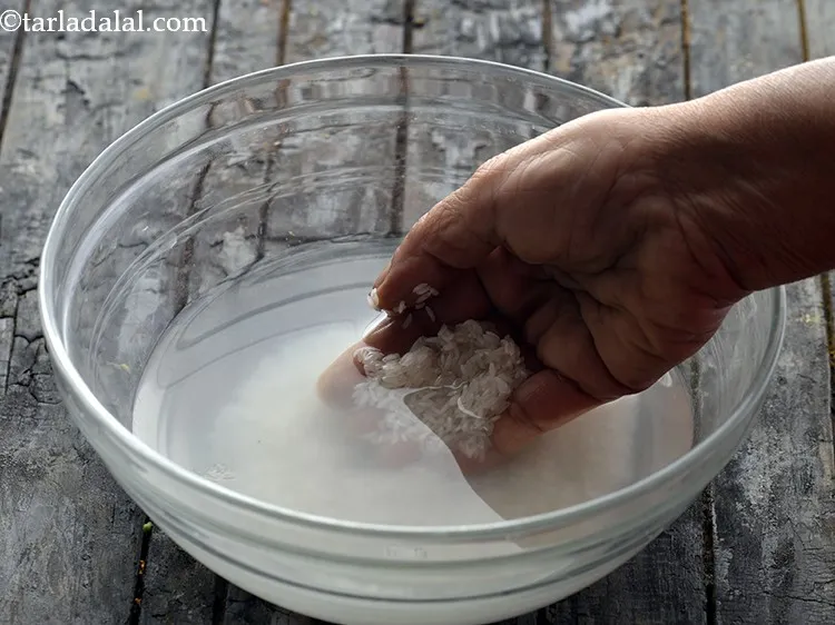 Step 12 – Clean and wash the rice with enough water.&nbsp;