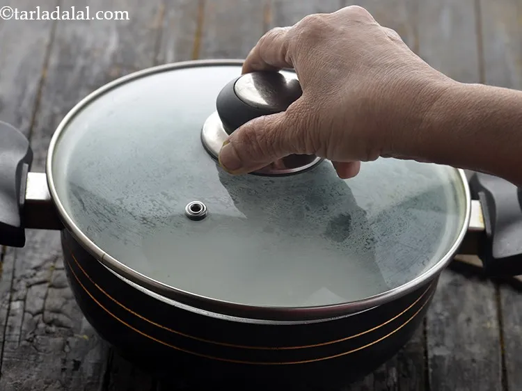 Step 15 – Cover the pan with a lid and cook on a medium flame for 10 minutes.&nbsp;