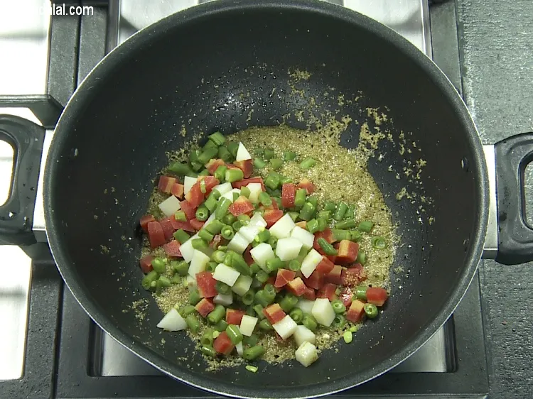Step 15 – Add&nbsp;1 cup&nbsp;<a href="https://tarladalal.com/glossary-chopped-and-boiled-mixed-vegetables-1884i">chopped and boiled mixed vegetables</a>(french beans , carrot and potatoes).
