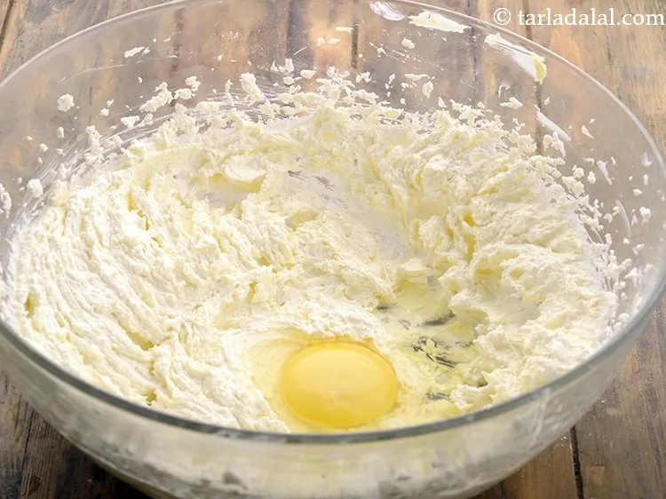 Step 17 – Add one egg. Eggs help in making the sponge cake airy and light.