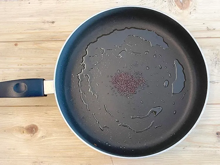 Step 19 – <html><head><meta charset="UTF-8"> </head><body><p>Add 1/2&nbsp;tsp&nbsp;<a href="glossary-mustard-seeds-sarson-rai-sarson-ke-beej-525i">mustard seeds ( rai / sarson)</a>.</p></body></html>