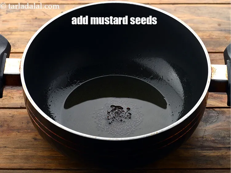Step 11 – Add 1/2 tsp&nbsp;<a href="https://www.tarladalal.com/glossary-mustard-seeds-sarson-rai-sarson-ke-beej-525i">mustard seeds ( rai / sarson)</a>.&nbsp;