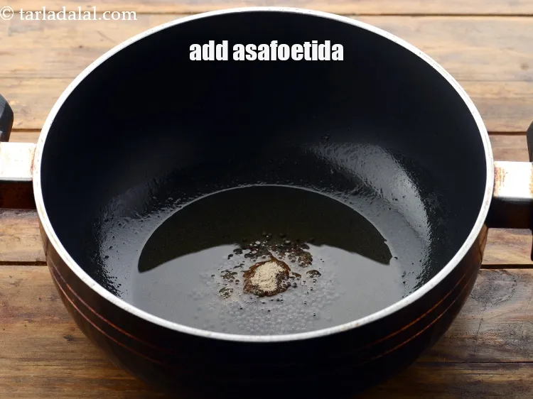 Step 12 – Add 1/4 tsp&nbsp;<a href="https://www.tarladalal.com/glossary-asafoetida-hing-113i">asafoetida (hing)</a>.&nbsp;