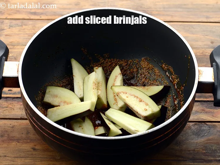 Step 17 – Add 1 cup&nbsp;thickly&nbsp;<a href="https://www.tarladalal.com/glossary-sliced-brinjals-130i">sliced brinjal (baingan / eggplant)</a>. See above how to slice them correctly.&nbsp;