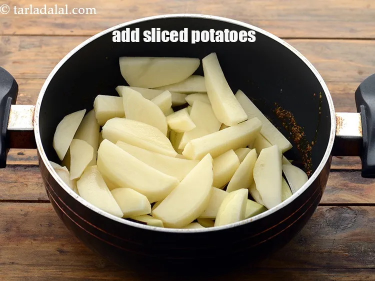 Step 18 – Add the 1 1/2 cups&nbsp;peeled and thickly&nbsp;<a href="https://www.tarladalal.com/glossary-sliced-potatoes-761i">sliced potatoes</a>.&nbsp;