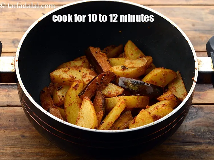 Step 20 – Cook on a slow flame for 10 to 12 minutes, while tossing occasionally.&nbsp;