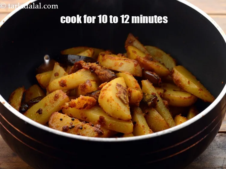 Step 25 – Cook on a medium flame for 10 t o12 minutes, while tossing it occasionally.&nbsp;