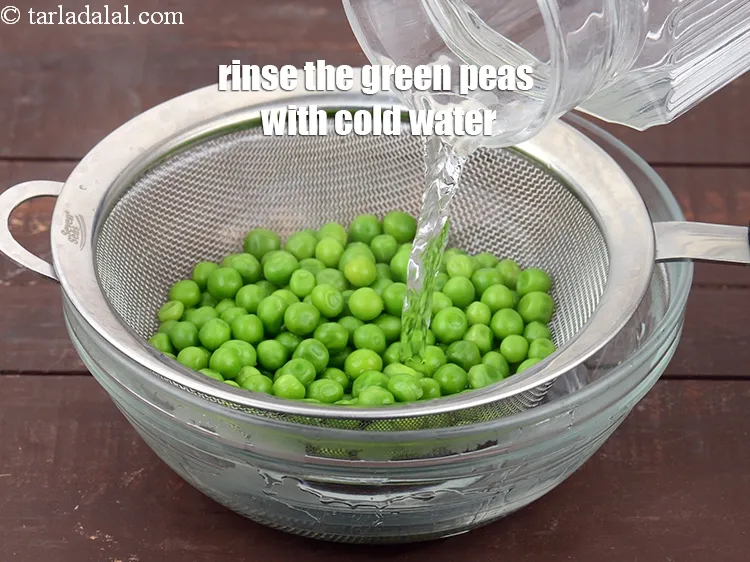 Step 12 – Rinse the green peas with cold water to stop further cooking and ensure maximum freshness.