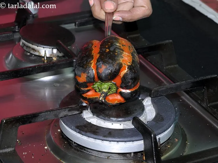 Step 17 – This is how to capsicum looks like after roasting. The skin will turn black in …