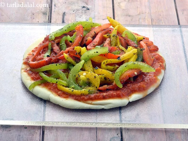 Step 29 – Arrange 1 portion of the roasted bell pepper topping evenly over it.