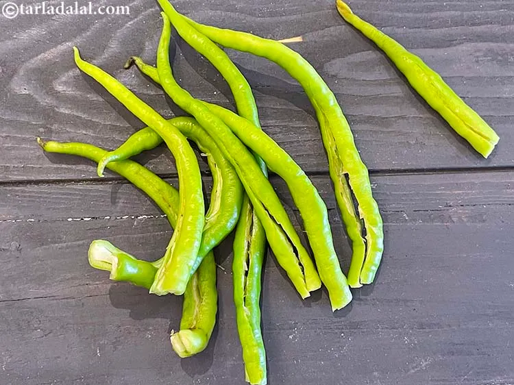 Step 4 – Slit the green chillies lengthwise using a sharp knife.