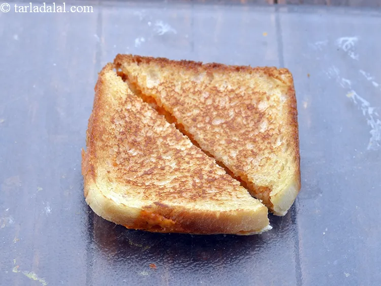 Step 21 – Cut the<strong> roasted red capsicum and cheese tava sandwich recipe | Indian capsicum cheese toast …