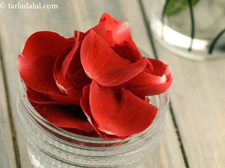 Step 20 – Add 1/4 cup&nbsp;shredded&nbsp;<a href="https://www.tarladalal.com/glossary-rose-petals-gulab-ke-patte-665i">rose petals</a>. Prefer to wash the rose petals before adding.&nbsp;