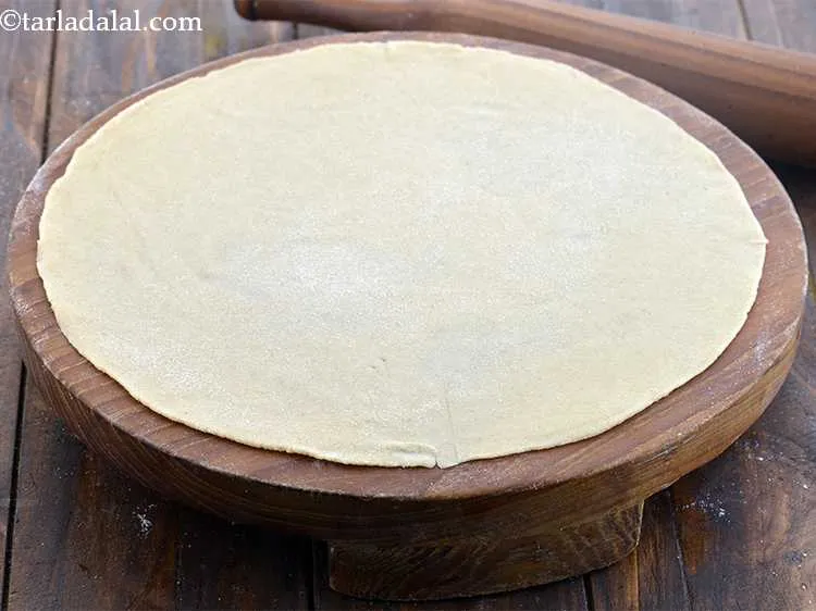 Step 12 – Sprinke a little flour on your rolling board and roll out each portion of the …