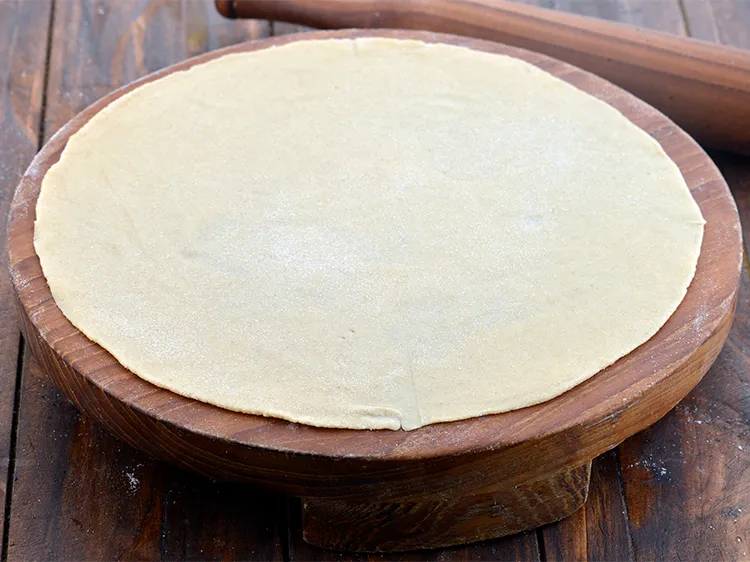 Step 11 – Sprinke a little flour on your rolling board and roll out each portion of the …