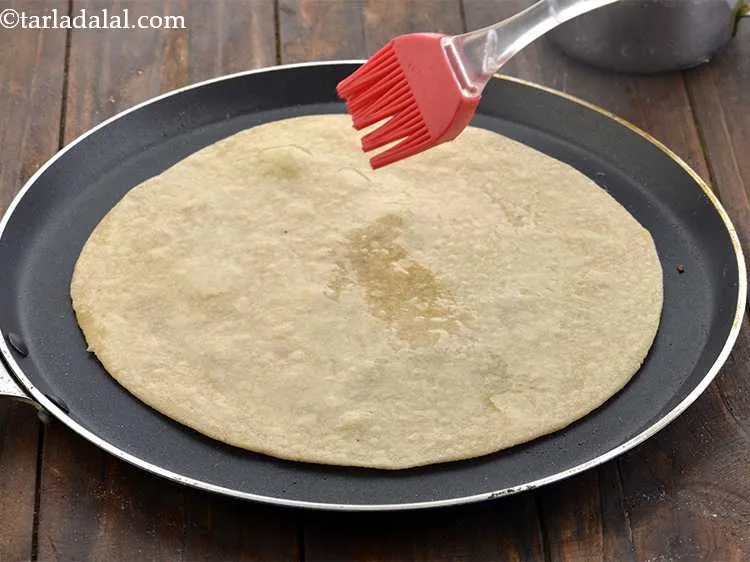 Step 14 – Cook the roti using 1/4 tsp of oil on each side.